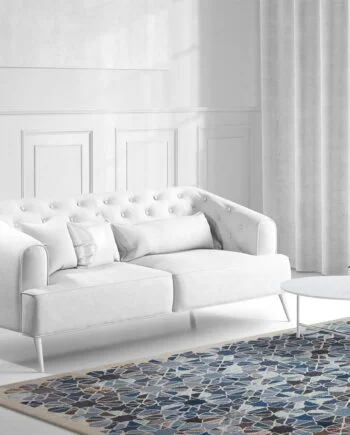 a living room filled with furniture and a large window