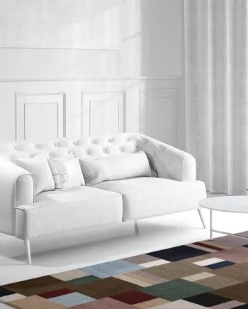 a living room filled with furniture and a large window