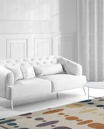 a living room filled with furniture and a large window