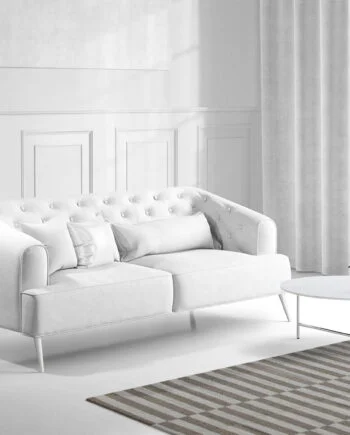 a living room filled with furniture and a large window