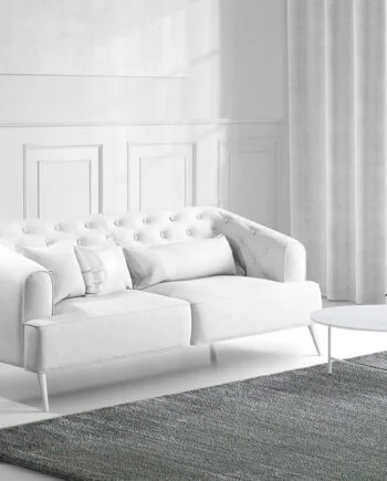 a living room filled with furniture and a large window