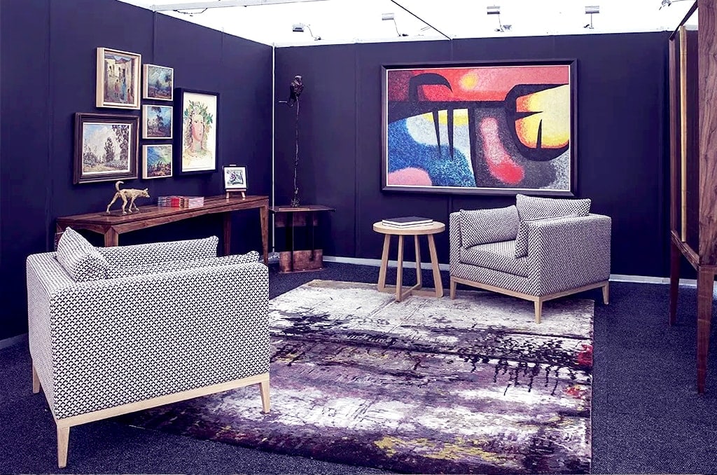 a room filled with furniture on an artisan rug
