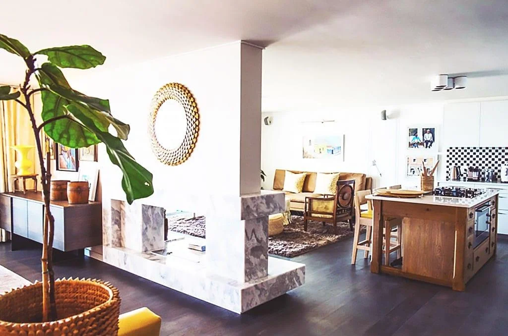a living room filled with furniture on top of a wooden table