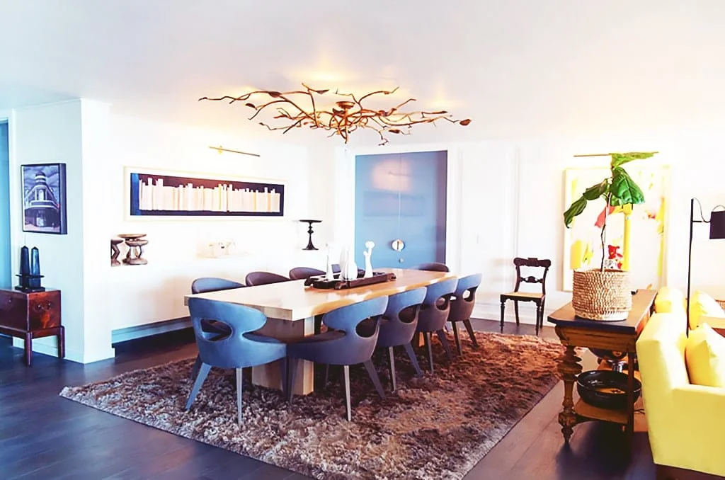 a living room filled with furniture and a table