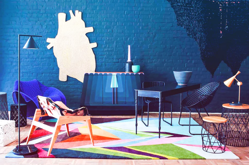 A table topped with an assortment blue furniture on a KLUK CGDT rug