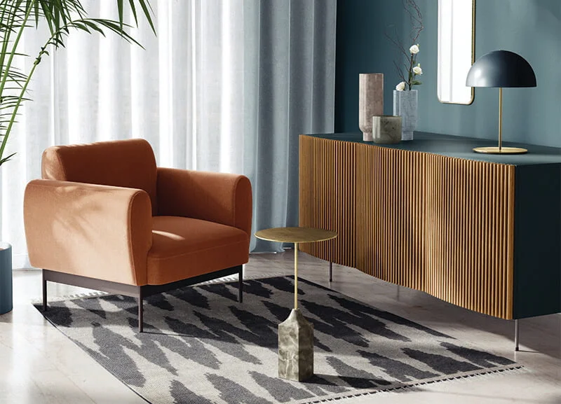 a room with a modern table and a chair on a rug